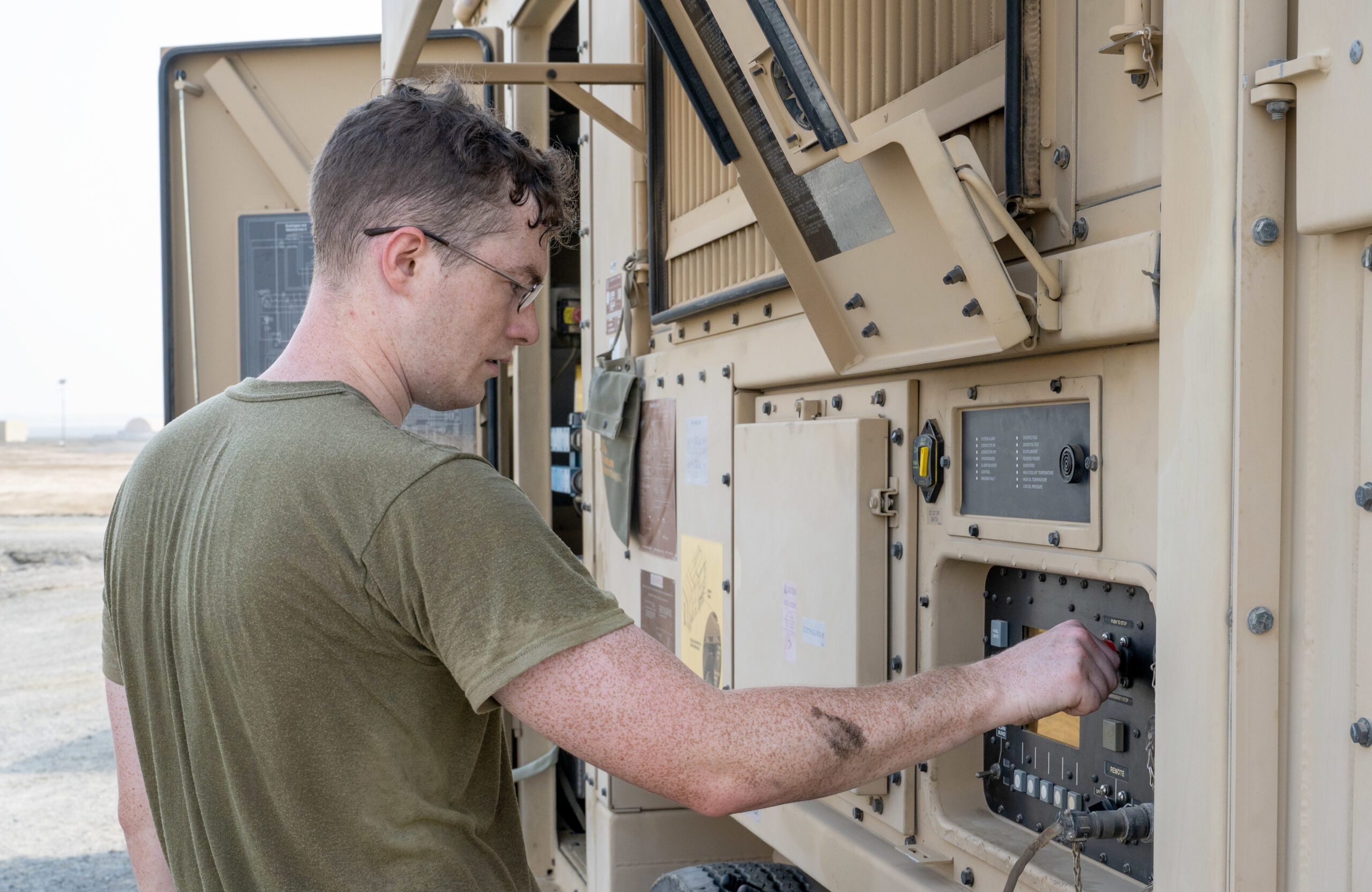 U.S. Air Force Senior Airman Carter Marietti, 380th Expeditionary Civil Engineer Squadron Electrical Power Production journeyman, starts a Basic Expeditionary Airfield Resources Power Unit after performing routine maintenance on the generator at Al Dhafra Air Base, United Arab Emirates, Sept. 21, 2023. After every 400 hours of runtime, the Electrical Power Production Unit changes the oil and replaces the fuel, oil, coolant and air filters for these types of generators. (U.S. Air Force photo by Tech. Sgt. Alex Fox Echols III)